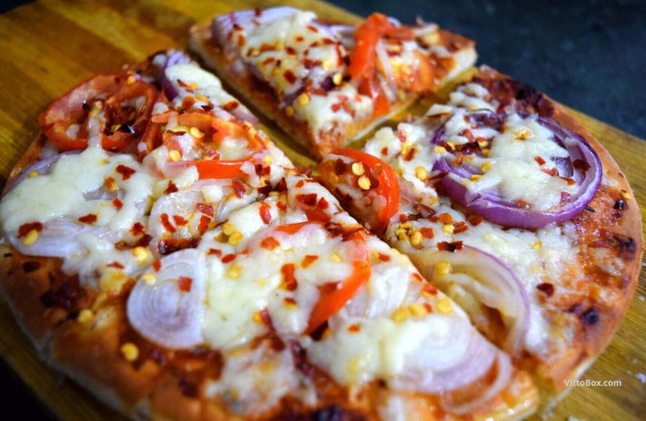 Cheese Pizza With Onion And Tomato Topping